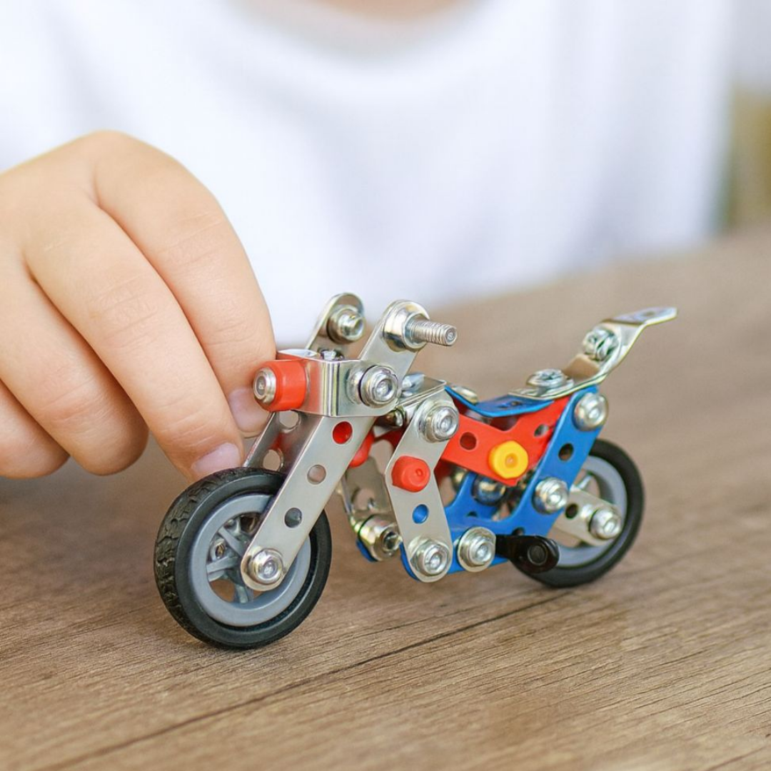 Speed Champions metal construction DIY building kits featuring a motorcycle and a red racing car with included tool sets