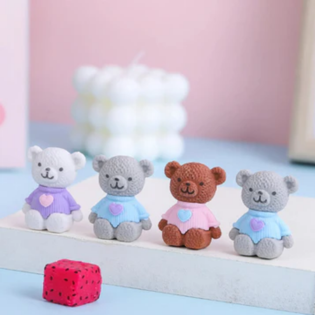 A group of colorful 3D bear puzzle erasers in various colors including blue, pink, and brown.