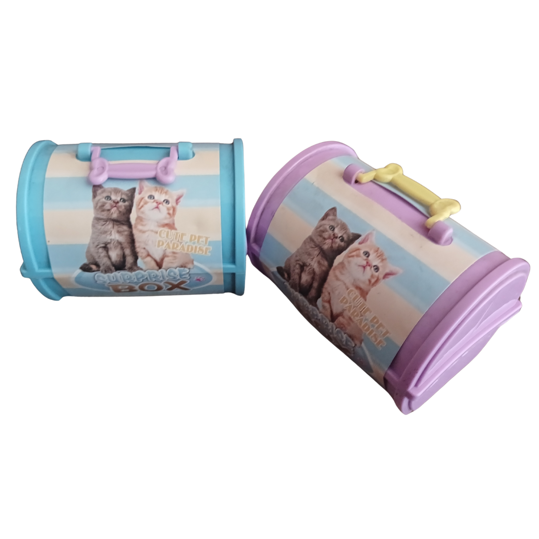 Two colorful toy pet carriers in blue and purple featuring kittens on the front label