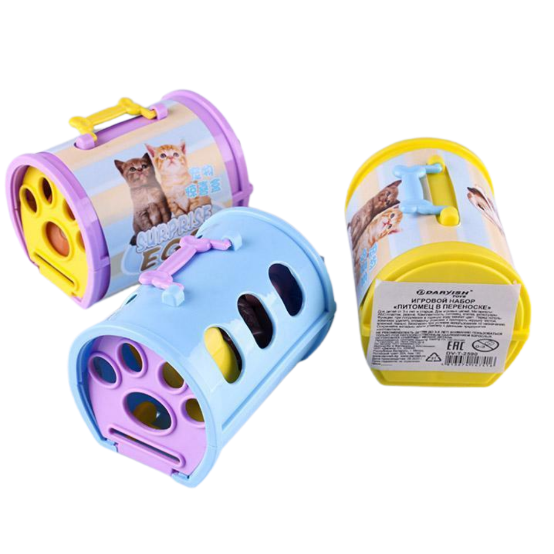 Two colorful toy pet carriers in blue and purple featuring kittens on the front label