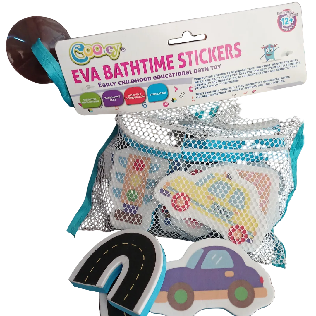 Cooey EVA Bathtime Stickers packaged in a white mesh net attached to a cardboard header card, showing a purple toy car piece, a curved road track piece, and a traffic light piece lying on a wooden surface below.