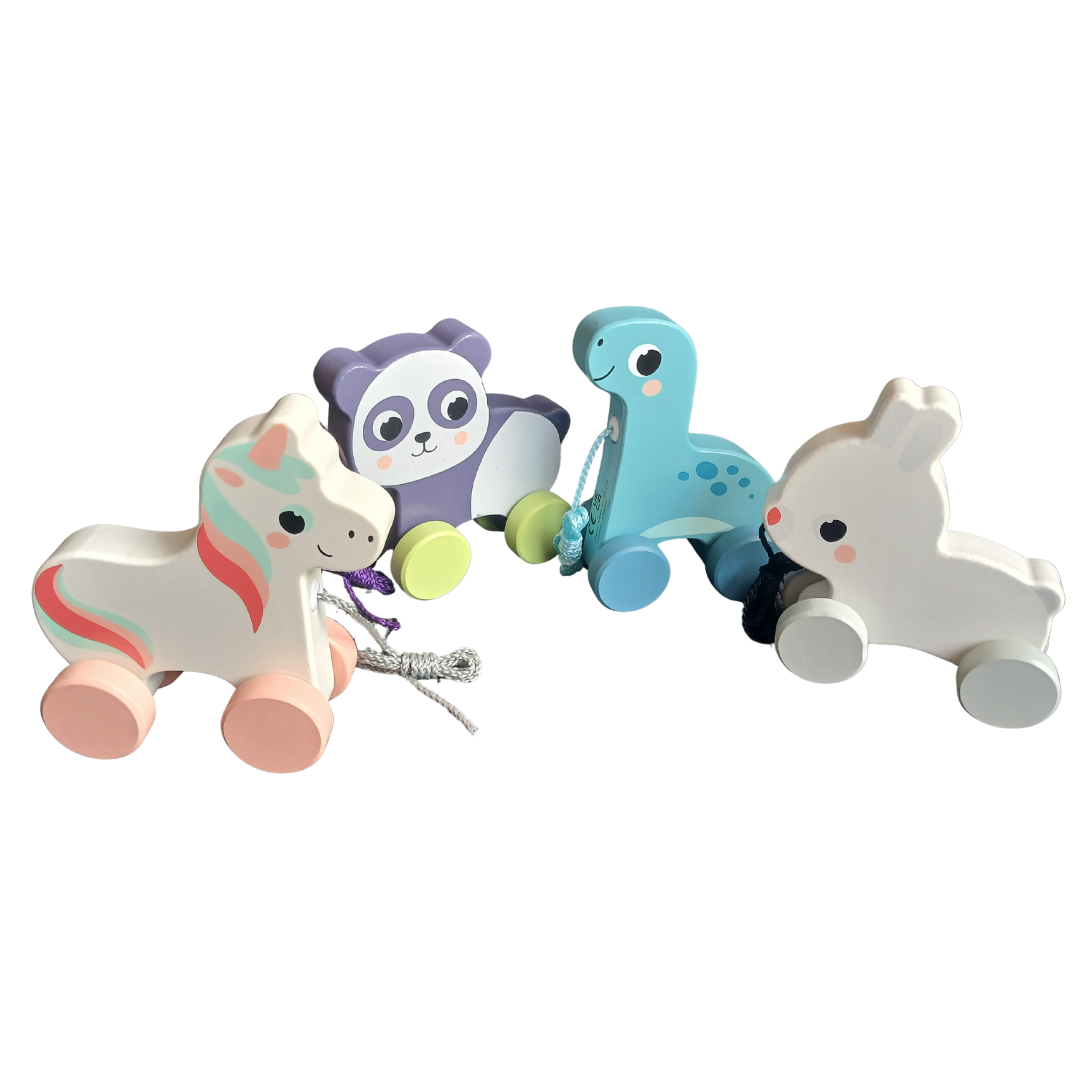 An assortment of four wooden pull toys: a white unicorn with pink mane, a purple panda, a blue dinosaur, and a white bunny.