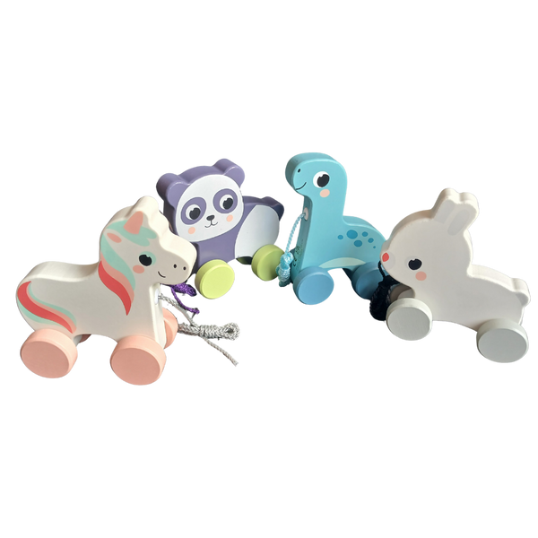 An assortment of four wooden pull toys: a white unicorn with pink mane, a purple panda, a blue dinosaur, and a white bunny.
