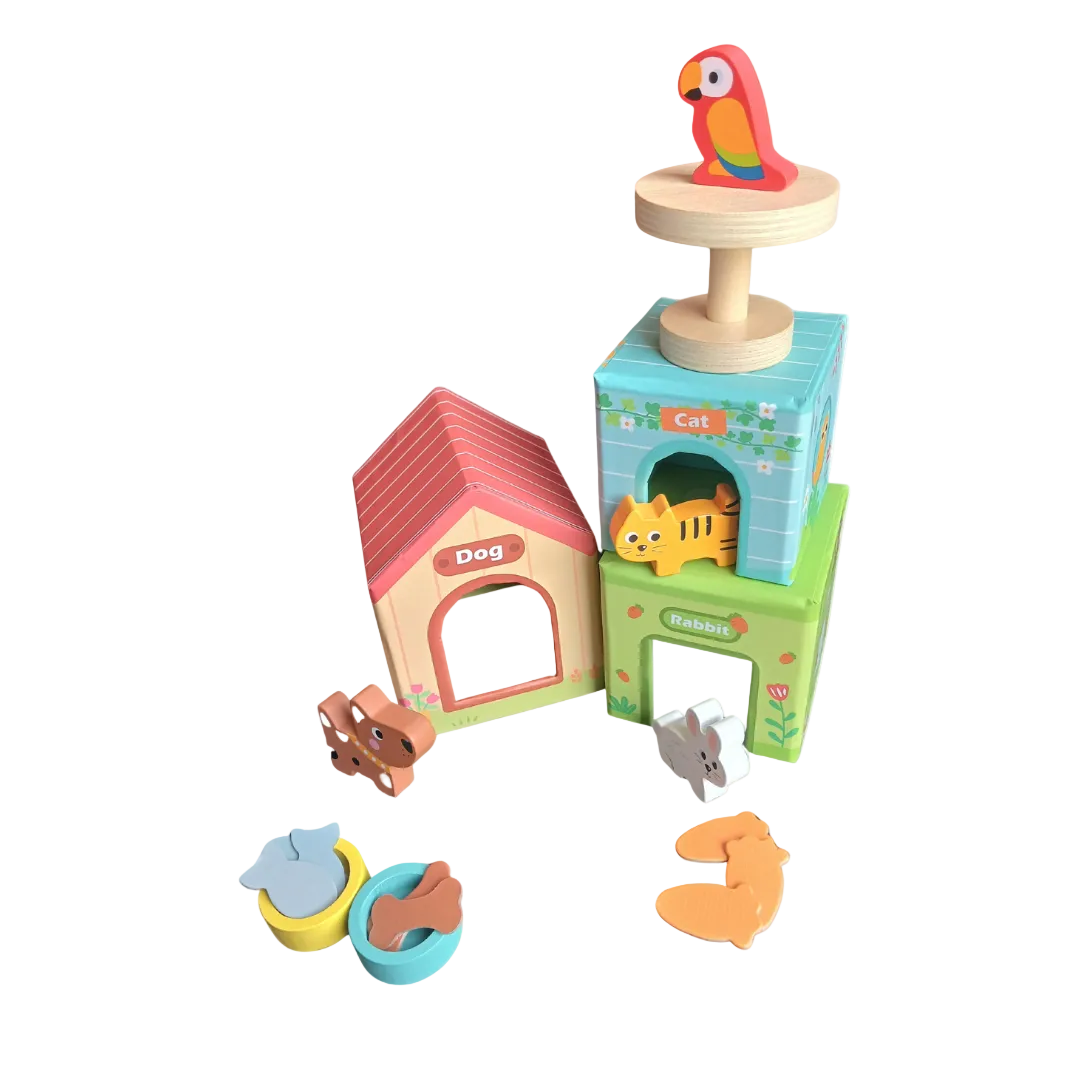Three colorful wooden pet houses stacked with a wooden toy dog, cat, and rabbit sitting in front.
