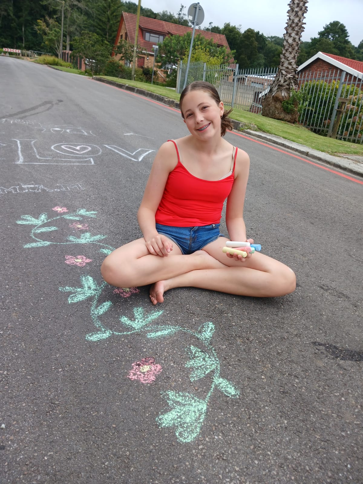 Khoki 5 Jumbo Chalk featuring five thick sticks of chalk in white, yellow, pink, green, and blue resting on a dark surface.