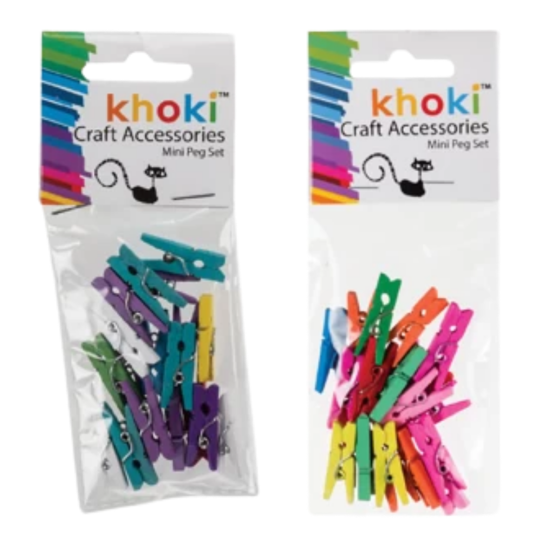 Khoki Craft Accessories Mini Peg Sets filled with small, colorful wooden craft pegs in shades of pink, green, yellow, blue, and red against a dark background.