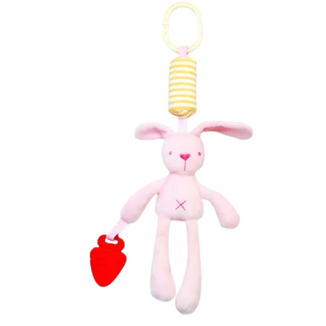 Soft pink plush dangling bunny baby toy with long floppy ears, a striped yellow hanging attachment, and a red strawberry-shaped teether accessory.