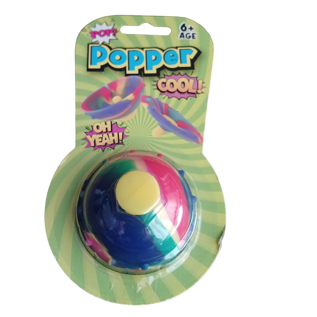 Retro Cool Tie-Dye Rubber Hip Popper toy in original green blister card packaging showing age 6 plus rating as referenced in Popper
