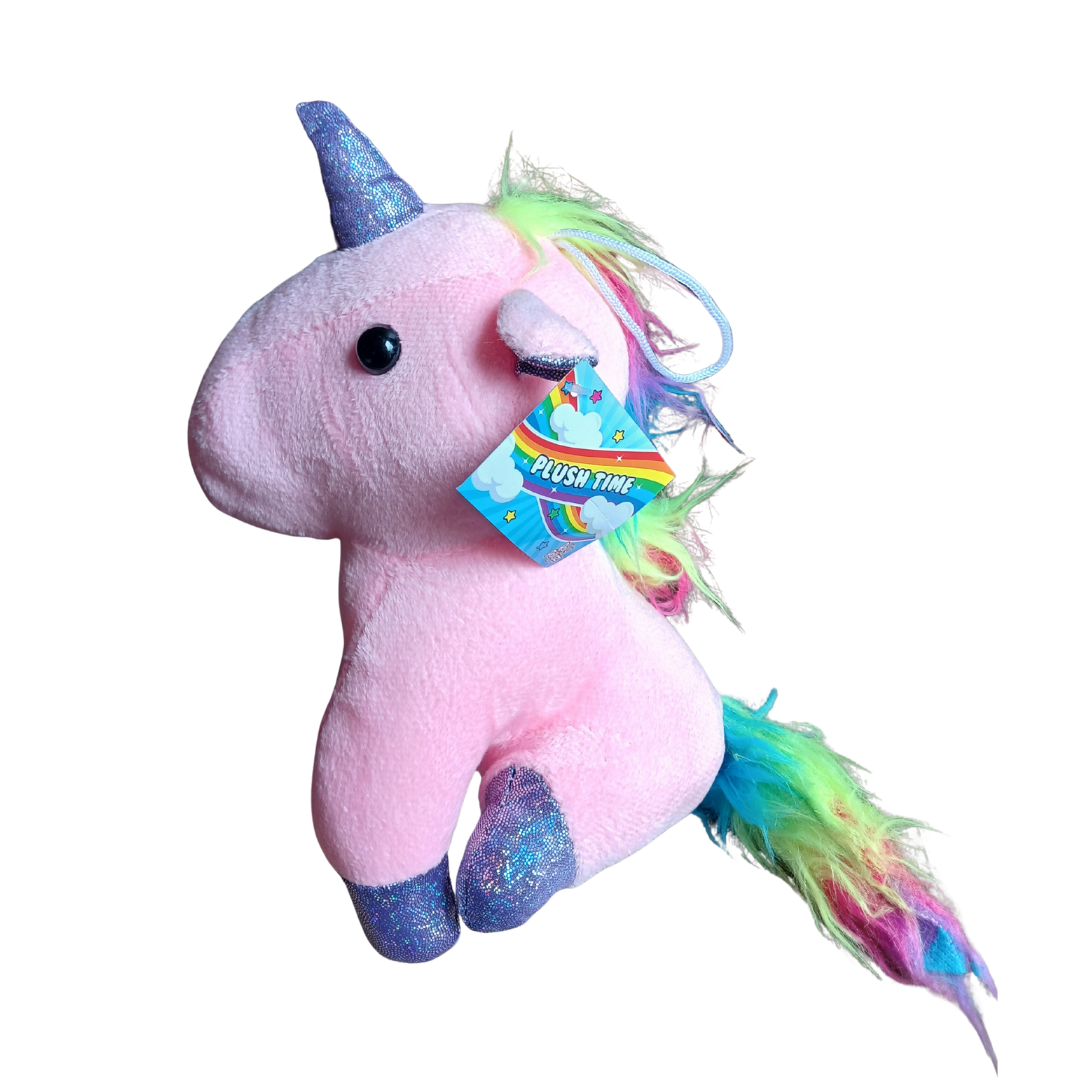 Side view of a pink rainbow unicorn plush toy with a glittery blue horn and multicolored tail.