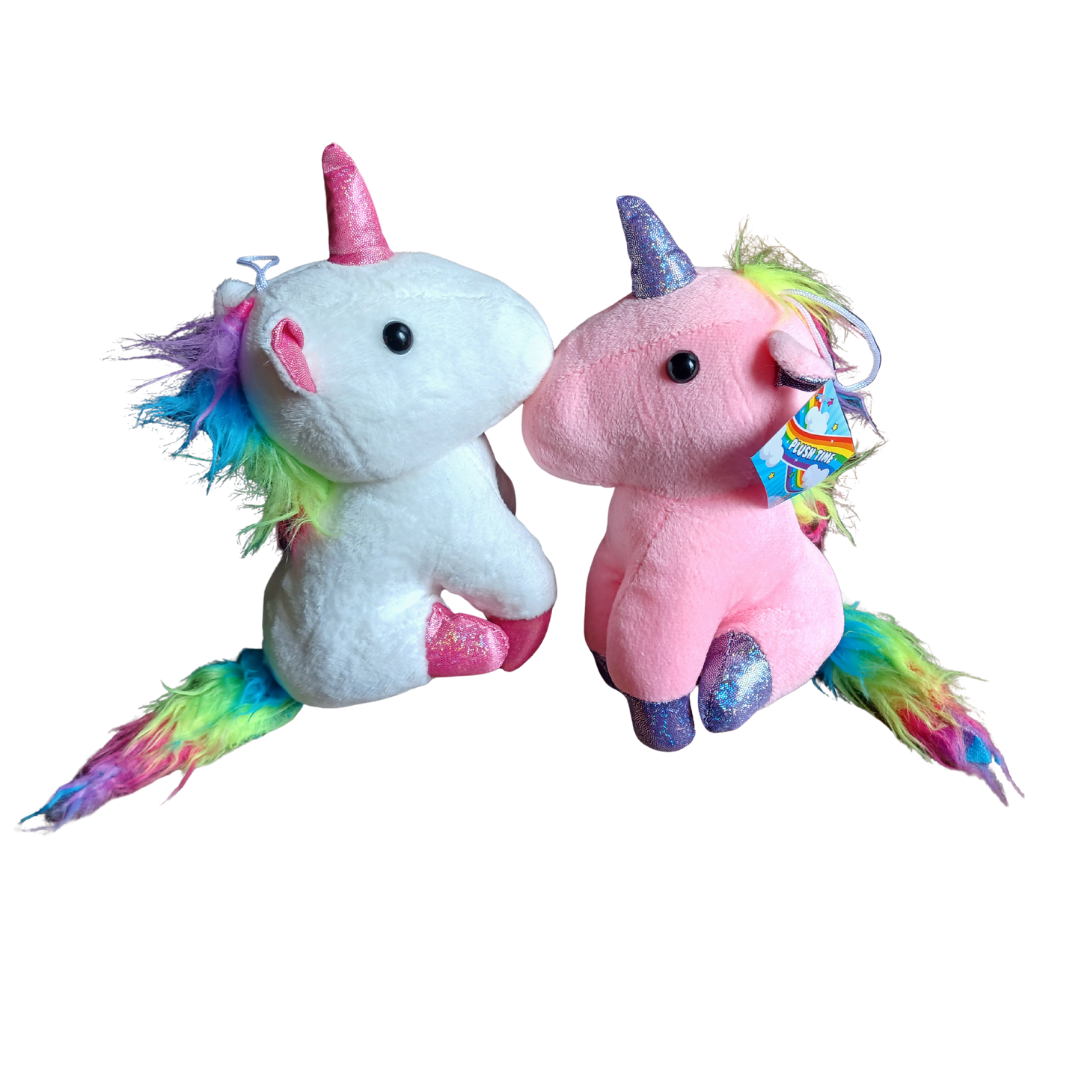Two rainbow unicorn plush toys in white and pink sitting together with sparkling horns.
