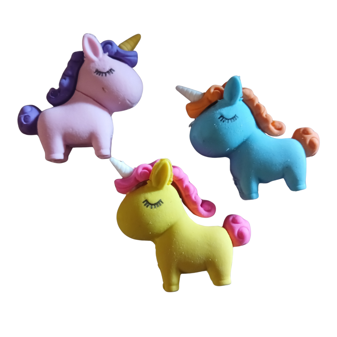 A collection of colorful 3D unicorn puzzle erasers in pastel pink, yellow, green, and blue.