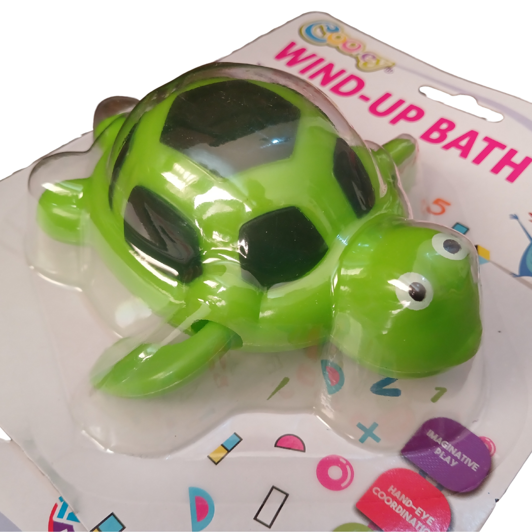 Cooey Wind-Up Bath Toys showing a green sea turtle with a black patterned shell and a sleek blue dolphin-shaped water toy on white backing cards.