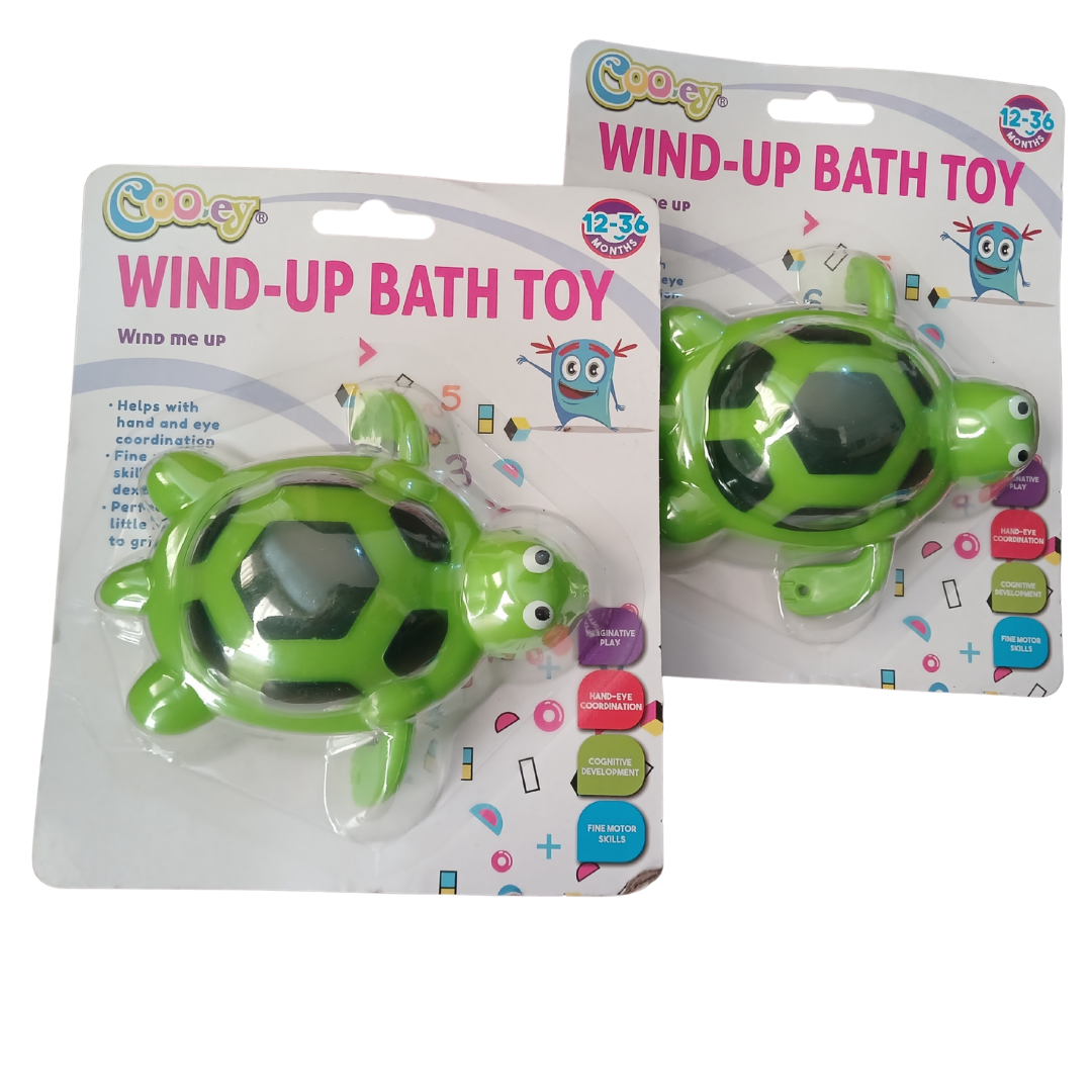 Cooey Wind-Up Bath Toys showing a green sea turtle with a black patterned shell and a sleek blue dolphin-shaped water toy on white backing cards.